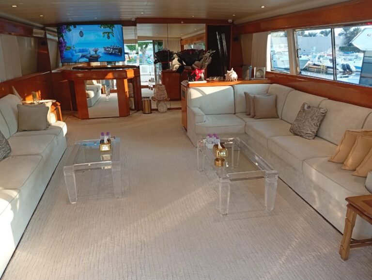 Corniche Yacht Rental Abu Dhabi 70 Raya 88 luxury yacht charter Abu Dhabi docked at marina.