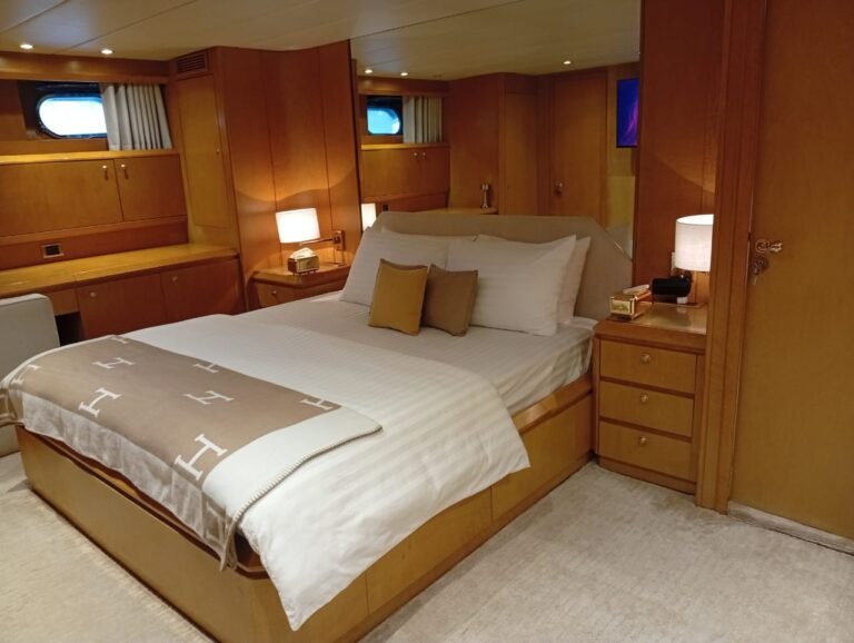 Corniche Yacht Rental Abu Dhabi 77 Elegant Raya 88 yacht in Abu Dhabi ready for private luxury charter, featuring spacious multi-deck layout